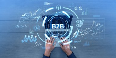 İşadamı elleri dizüstü bilgisayarda yazıyor. Simgeler ve ön x istatistikleriyle B2b parlayan daire hologramı. Finansal pazarlama kavramı, ticaretten ticarete, ticaretten yatırıma