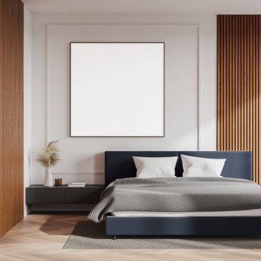 Yatak odasının içinde yatağın üzerinde boş bir tuval var. Parlak, minimalist tasarım, ahşap aksanlı ve rahat bir atmosferi var. 3B Hazırlama