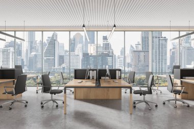 Modern mobilyaları olan açık bir uzay ofisi, şehrin ufuk çizgisini gösteren büyük pencereler. Beton zemin ve minimalist dekor. Çağdaş çalışma alanı kavramı. 3B Hazırlama