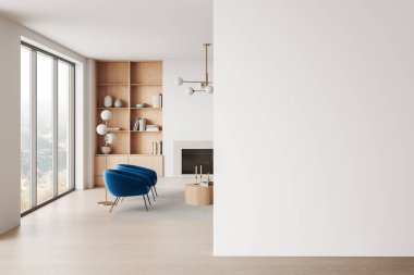 Mavi sandalyeler, ahşap raflar ve maket için mükemmel boş bir duvar olan zarif bir oturma odası. Doğal ışık ile modern tasarım. 3B Hazırlama