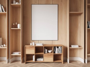 Kitaplar ve dekorlarla dolu modern bir ahşap kitaplıkta sergilenen boş poster modeli, minimalist bir iç tasarım konsepti yaratıyor. 3B Hazırlama