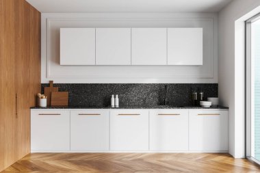 Modern mutfak, beyaz dolaplar, ahşap aksanlar ve parlak bir tezgah. Ahşap zemin ve parlak doğal ışık. Minimalist ev tasarımı kavramı. 3B Hazırlama