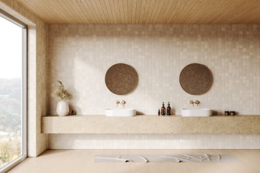 İkiz lavaboları ve fayanslı duvarında yuvarlak aynaları olan minimalist bir banyo, büyük bir pencereden gelen doğal ışık. 3B Hazırlama