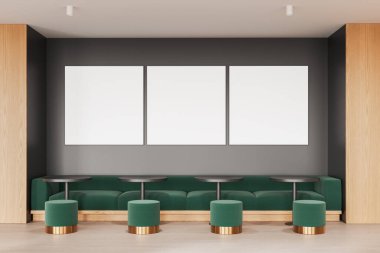 Renkli restoran içi yeşil kanepe ve yuvarlak masalar, beton zemin. Minimalist yemek alanı ve üç adet kare tuval posterleri. 3B görüntüleme