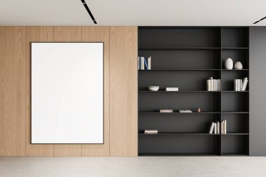 Minimalist bir kitaplığın yanındaki tahta duvarda asılı boş bir poster modeli. Çok yönlü tasarım projeleri için modern estetik. 3B Hazırlama