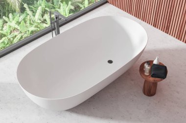 Modern minimalist banyo, beyaz serbest banyo küveti, banyo malzemeleri ve havlusu olan ahşap masa, açık yeşil pencereli geniş bir pencere. 3B Hazırlama