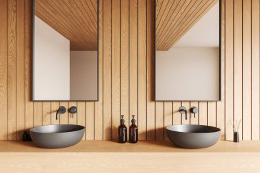 İki lavabo, ayna ve ahşap kaplamalı şık bir banyo. Huzurlu arka plan, modern minimalizm kavramını geliştirir. 3B Hazırlama