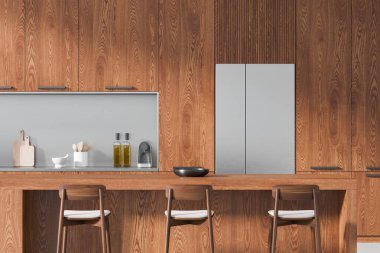 Açık ahşap ev mutfağı, bar adası ve dolap. Şık bir dairede mutfak gereçleri ve buzdolabı ile lüks yemek pişirme alanı tasarımı. 3B görüntüleme