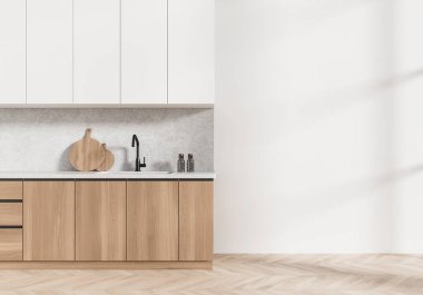 Ahşap dolapları, musluğu, kesme tahtaları ve boş beyaz duvarı olan modern bir mutfak. Minimalist tasarım ve doğal ışık kavramı. 3B Hazırlama