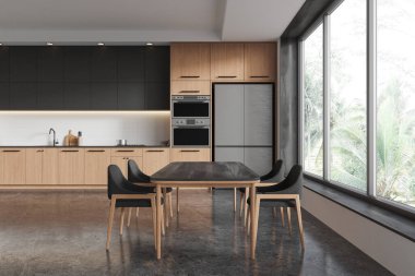 Ahşap dolaplı şık mutfak, siyah aksanlı ve geniş pencereli. Parlak zeminde minimalist tasarım. Çağdaş ev kavramı. 3B Hazırlama