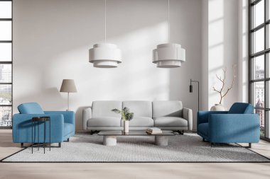 Gri bir kanepe, mavi koltuklar ve parlak, ferah bir iç mekanda minimalist dekorun yer aldığı modern bir oturma odası. Modern evin tasarım konsepti. 3B Hazırlama