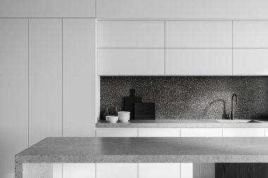 Modern mutfak, beyaz dolaplar, gri tezgah, ve koyu bir arka plan. Ev ortamında minimalist tasarım. 3B Hazırlama