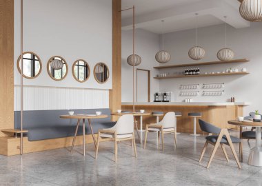 Kafenin içinde hafif ahşap mobilyalar, yuvarlak aynalar ve tarafsız bir arkaplanda kolye ışıkları sergilenerek samimi ve minimalist bir konsept yaratılıyor. 3B Hazırlama