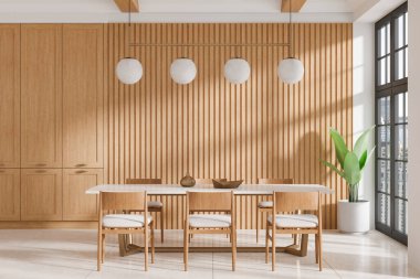 Modern dining room with wooden chairs and table, slatted wood wall paneling, minimalist lighting, and large windows. Natural and cozy home interior concept. 3D Rendering. clipart