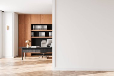 Sağında boş beyaz bir duvar olan modern ofis, arka planında klasörler olan ahşap raflar, ve lambalı bir masa, minimalist, profesyonel bir düzen sunuyor. 3B Hazırlama.