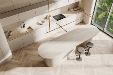 Hafif ahşap tonları, gösterişli dolapları ve tabureli modern bir adası olan minimalist bir mutfağın en üst görüntüsü. Parlak doğal ışıklandırma, ahşap döşeme. 3B Hazırlama