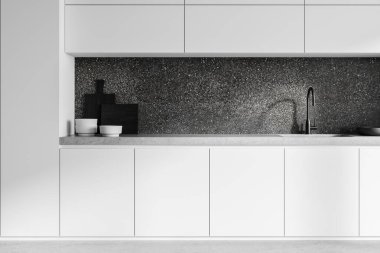 Beyaz dolaplı modern mutfak, parlak siyah musluk, desenli koyu renk arka plan, ve minimum dekor. Tarafsız bir arkaplan. Basitlik ve temizlik kavramı. 3B Hazırlama.