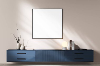 Modern mavi bir dolabın üstündeki minimalist bir duvara çerçevelenmiş boş bir poster dekor, kitaplar ve bir lamba. İç dekordaki duvar modelleme şablonu kavramı. 3B Hazırlama