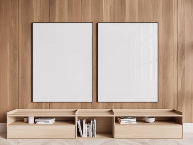 Modern bir mekanda kitap ve dekor tutan minimalist bir raf ünitesinin üzerinde, ahşap bir duvarda iki boş dikdörtgen çerçeve. 3B Hazırlama.