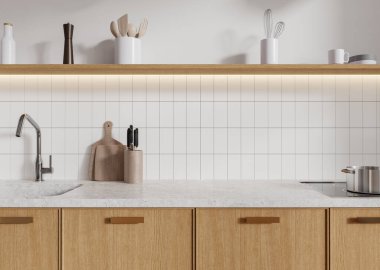 Ahşap dolaplar, beyaz fayanslı duvarlar ve minimalist tezgahlardan oluşan modern mutfak. Parlak, temiz bir atmosfer ve mutfak aletleri. 3B Hazırlama