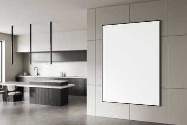 Zarif tezgahları, karanlık dolapları ve duvarında boş çerçeveli bir posteri olan minimalist bir mutfak. Parlak ışıklandırma modern bir estetik yaratır. 3B Hazırlama.