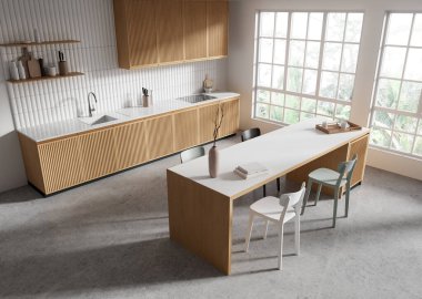 Ahşap dolapları, beyaz tezgahları ve küçük dekorları olan çağdaş bir mutfak, geniş pencereli parlak bir alana kurulmuş. Modern tasarım kavramı. 3B Hazırlama.