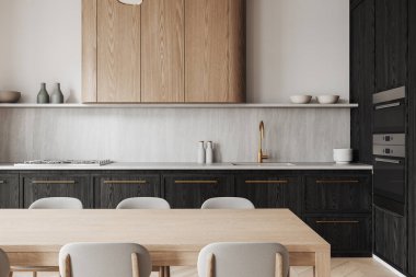 Hafif ahşap masalı modern mutfak, altın aksanlı karanlık dolap, ve beyaz minimalist arka plan. Parlak, çağdaş tasarım konsepti. 3B Hazırlama.