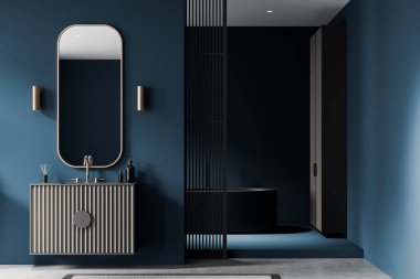 Modern gösterişli, yuvarlak aynalı, minimalist dekorlu ve parlak mavi duvarlı şık bir banyo. 3B Hazırlama, modern konsept
