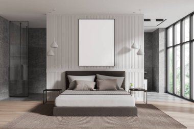 Yastıklı, kolye lambalı ve modern yatak odasındaki sehpaları olan bir yatağın üzerinde boş bir poster bilgisayarı. 3B Hazırlama