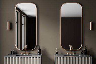 Metalik musluklar, oval aynalar ve gösterişli modern bir banyoda minimalist dekorlarla çift lavabo. Tarafsız ses tonları. Lüks tasarım kavramı. 3B Hazırlama.