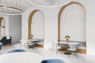 Beyaz duvarlı, altın aksanlı modern kafe, kemer şekilli kabinler, minimalist masalar ve sandalyeler, ve sıcak ışıklandırma, zarafet ve konfor yaratır. 3B Hazırlama.