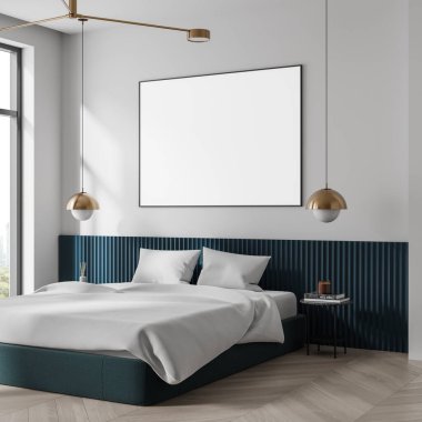 Yatak odasının içinde beyaz bir duvarda boş çerçeveli bir poster, döşeme döşemesi, rahat yatak örtüsü ve altın kolye ışıkları. 3B Hazırlama