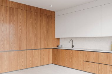 Ahşap dolaplar, beyaz tezgah ve temiz çizgiler içeren gösterişli mutfak iç mimarisi modern bir minimalist tasarım konsepti içeriyor. 3B Hazırlama.