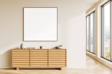 Çerçevelenmiş boş tuval bej bir duvarda asılı, ahşap bir büfenin üzerinde. Büyük pencerelerden geçen doğal ışık. İç modelleme görüntüsü kavramı. 3B Hazırlama.