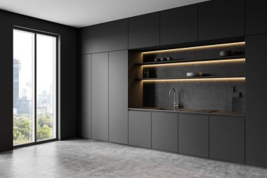 Pürüzsüz gri dolaplar, aydınlatılmış raflar, beton zemin ve şehir manzarasını çerçeveleyen büyük bir pencere ile şık bir mutfak. 3B Hazırlama
