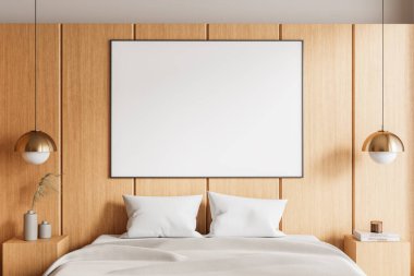Yatak odasının içinde ahşap panelli bir duvarda boş çerçeveli bir poster, rahat yatak örtüsü, kolye lambaları ve dekorlu yan masalar var. Modern tasarım. 3B Hazırlama.