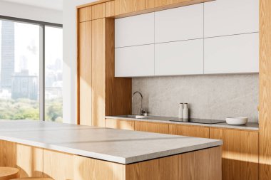 Ahşap dolapları, beyaz üst deposu ve beton tezgahı olan çağdaş bir mutfak. Büyük pencereler doğal ışık sağlar. 3B Hazırlama