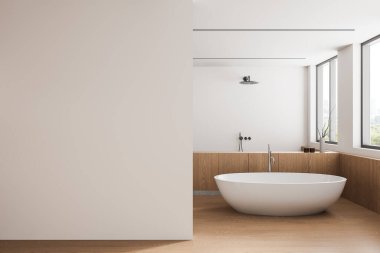 Boş bir duvar ve modern bir serbest banyo küveti olan zarif minimalist bir banyo. Büyük pencereler, doğal ışığın temiz iç tasarımı geliştirmesine olanak sağlar. 3B Hazırlama.