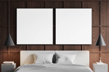 Modern yatak odasının içinde iki büyük boş çerçeveli posterler var. Koyu tahta bir panel duvarda. Yastıklı ve kolyeli bir yatak şık bir ortam yaratır. 3B Hazırlama.
