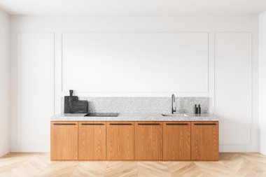 Ahşap dolapları, granit tezgahı ve poster veya sanat sergisi için boş beyaz duvarı olan modern mutfak. Temiz ve zarif tasarım konsepti. 3B Hazırlama.