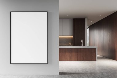 Modern bir mutfağın yanındaki açık gri duvarda, ahşap paneller ve beton kaplamalı büyük çerçeveli boş bir poster. Parlak iç tasarım konsepti. 3B Hazırlama.