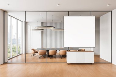 Çağdaş ofis içi, cam bölmelerinde büyük boş çerçeveli poster var. İçinde sandalyeler, kolye ışıkları ve ahşap döşemeler olan bir toplantı masası. 3B Hazırlama.