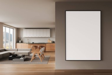 Duvarında büyük boş bir poster olan modern iç mekan, şık bir açık mutfak ve ahşap mobilya ve nötr tonlarla yaşam alanı içeriyor. 3B Hazırlama