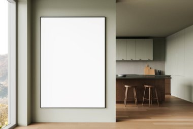 Pastel yeşil duvardaki boş beyaz poster şık bir mutfak içinde. Ahşap zemin, tabure ve dolaplar rahat bir atmosfer yaratıyor. Tasarım sunumu için mükemmel. 3B Hazırlama.