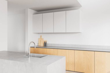 Hafif ahşap dolaplı minimalist mutfak, beton tezgahlar, ve tarafsız arka planda temiz beyaz iç döşemeli modern musluk. Basitlik kavramı. 3B Hazırlama