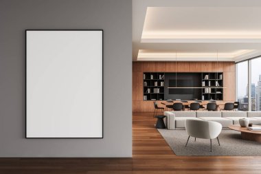Gri duvarda boş çerçeveli bir poster, ahşap döşemeli, geniş pencereli, modern mobilyalı açık alan yaşam ve yemek alanı. 3B Hazırlama
