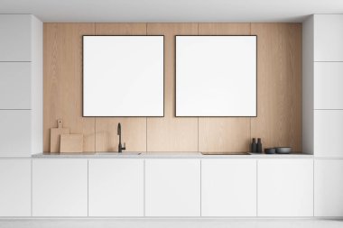 Minimalist mutfak iç mimarisi. Beyaz dolapların ve tezgahların üstündeki ahşap duvarda iki boş poster var. 3 boyutlu düzenleme, temiz tasarım konsepti.