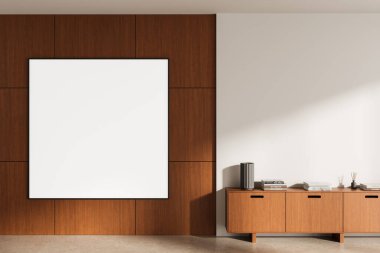 Ahşap paneli duvarında büyük boş bir poster ve pürüzsüz zeminde şık bir dolap, ev tasarımında temiz pankart modelleme şablonu. 3B Hazırlama