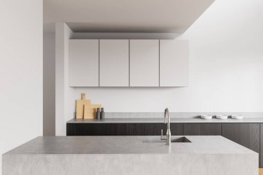 Çimento adası, beyaz üst dolaplar, koyu alçak dolaplar ve açık arkaplanda ahşap aksanlı lüks modern mutfak. Minimalist tasarım kavramı. 3B Hazırlama