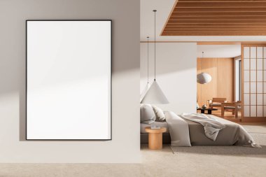 Modern minimalist yatak odasındaki beyaz duvarda boş dikey poster modeli yumuşak ışıklandırma, ahşap aksanlar ve samimi nötr tonlar. 3B Hazırlama